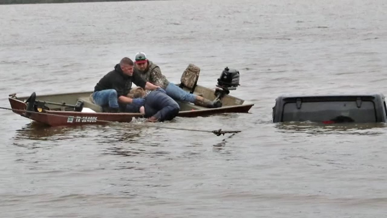 Missing woman found alive in almost completely submerged vehicle