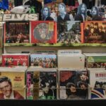 woman in black framed eyeglasses holding red and white labeled box
