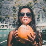 photo of girl drinking coconut