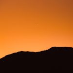 silhouette of mountain during sunset